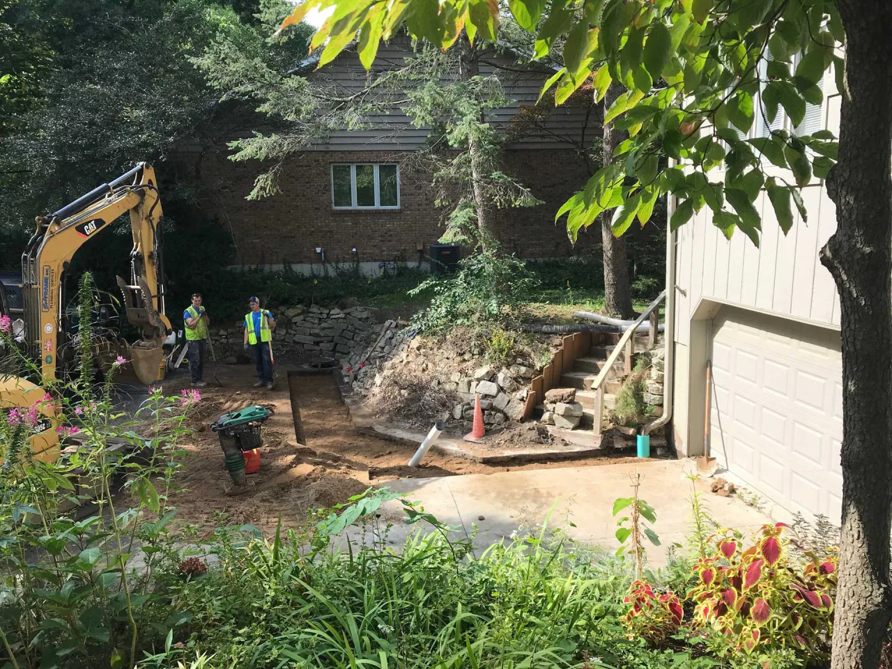 A Bob Frame Plumbing crew excavating a residential sewer line