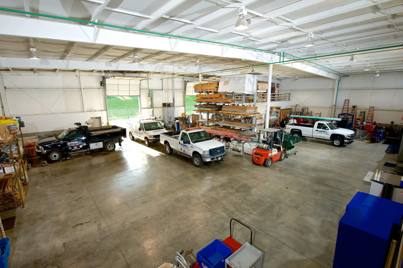 Inside the Bob Frame Plumbing shop on Jaclyn Court, with service trucks and stocked material racks