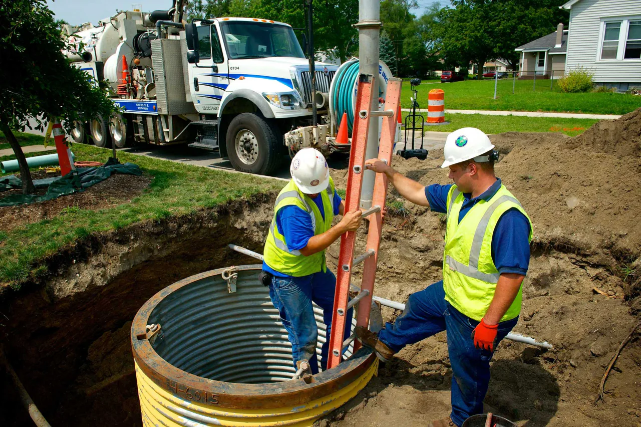 Bob Frame Plumbing crew at a city repair with a vac truck